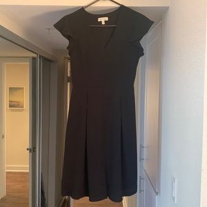 Black short sleeve dress. Falls right above the knees (5’8”)
